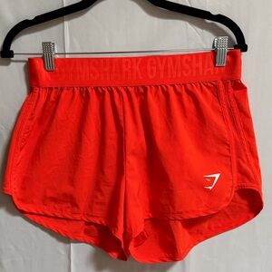 P31. Gymshark Orange Workout Shorts
Size: M